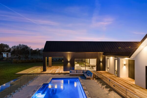 KAD Build new build poolside exterior Verdeco Blvd at dusk, Kirwee, Leeston, Rolleston, Hororata, Springfield, Prestons Park, Canterbury, New Zealand